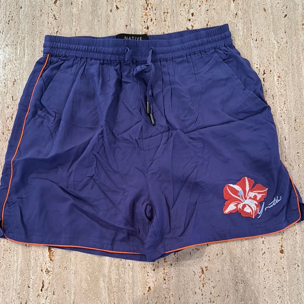 Native Men's Blue Shorts with Red Accents